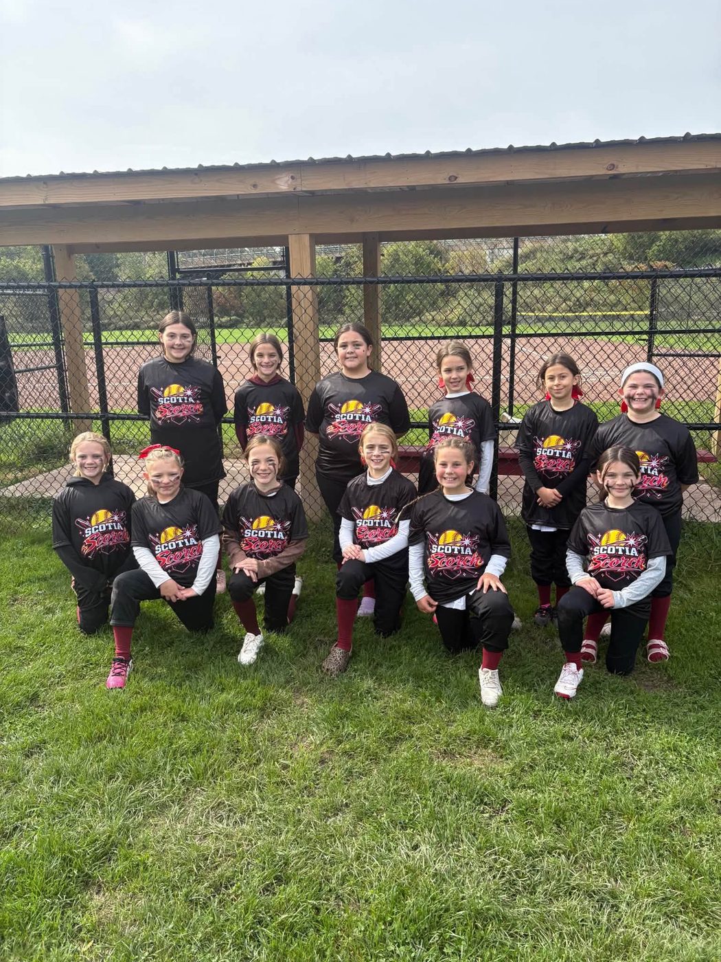 Scotia Sparks softball players in custom team shirts