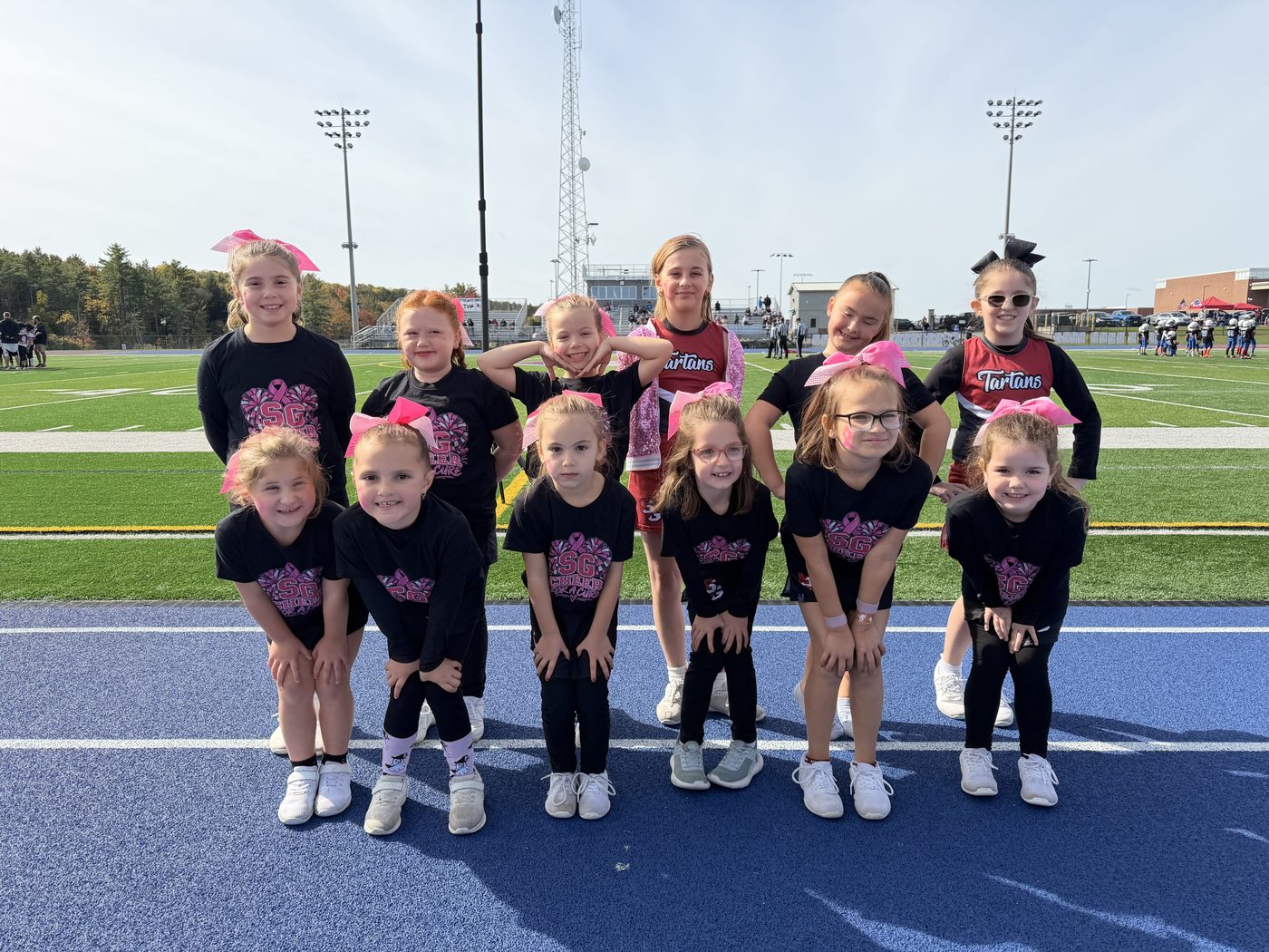 SG cheer squad in custom pink SG team shirts